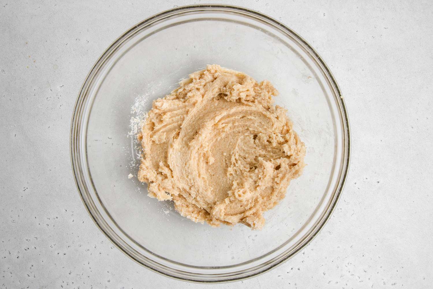 Creamed butter and sugar to make chewy double chocolate cookies.