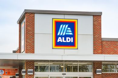 Storefront of Aldi with the logo prominently displayed on the building