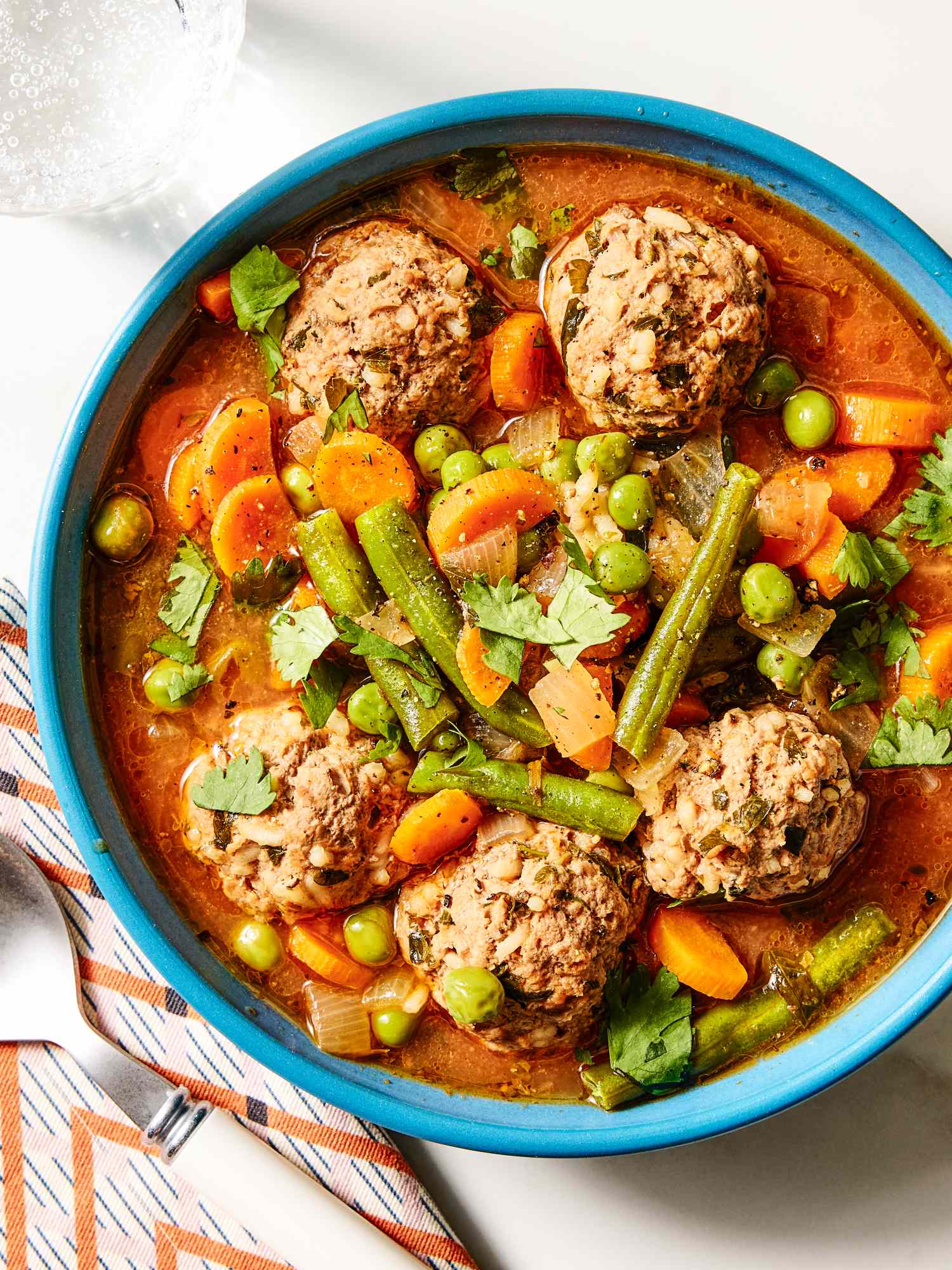Mexican meatball soup with vegetables served in a bowl