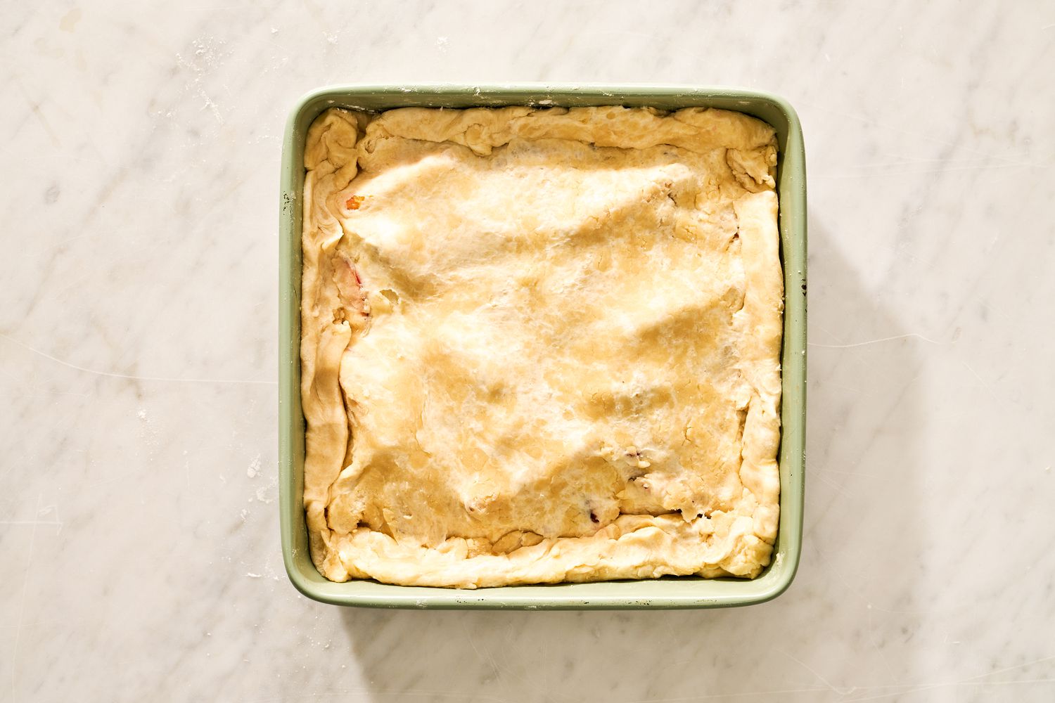 crust added on top of peach and raspberry filling for for peach and raspberry pandowdy recipe