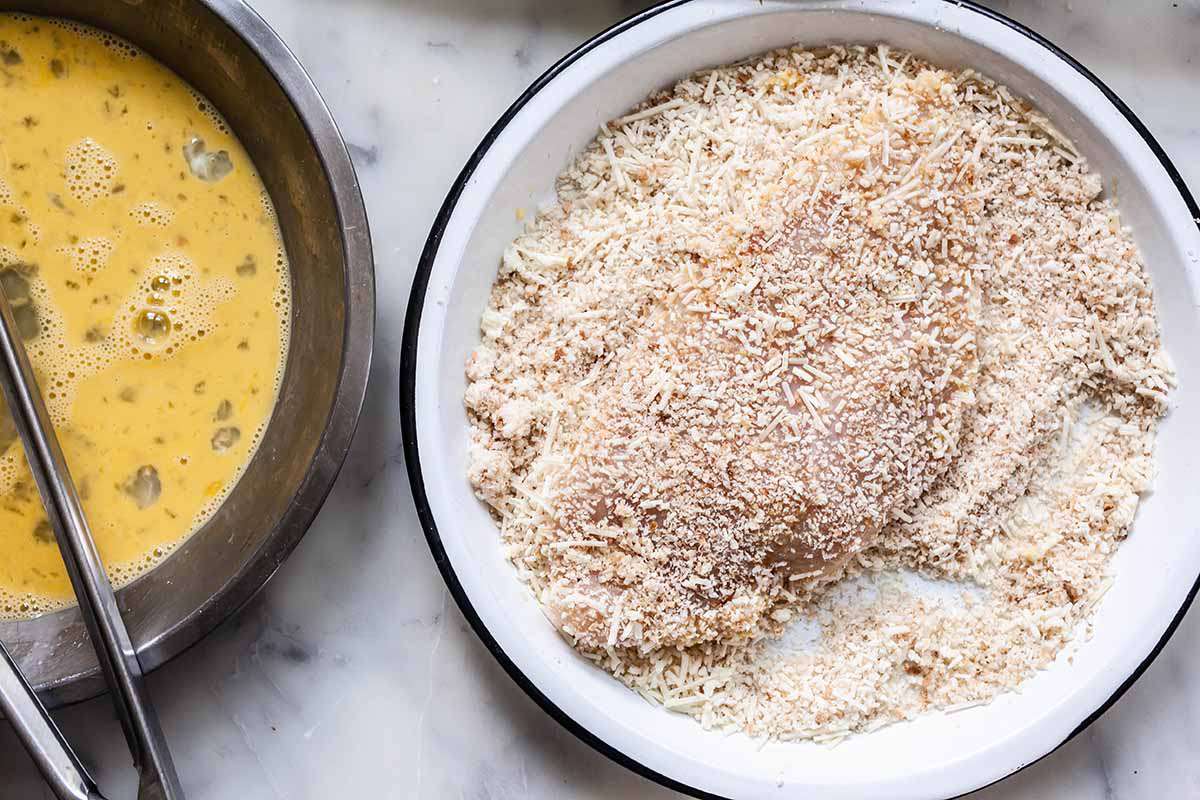 Baked Chicken Parmesan dredge the chicken in breadcrumbs