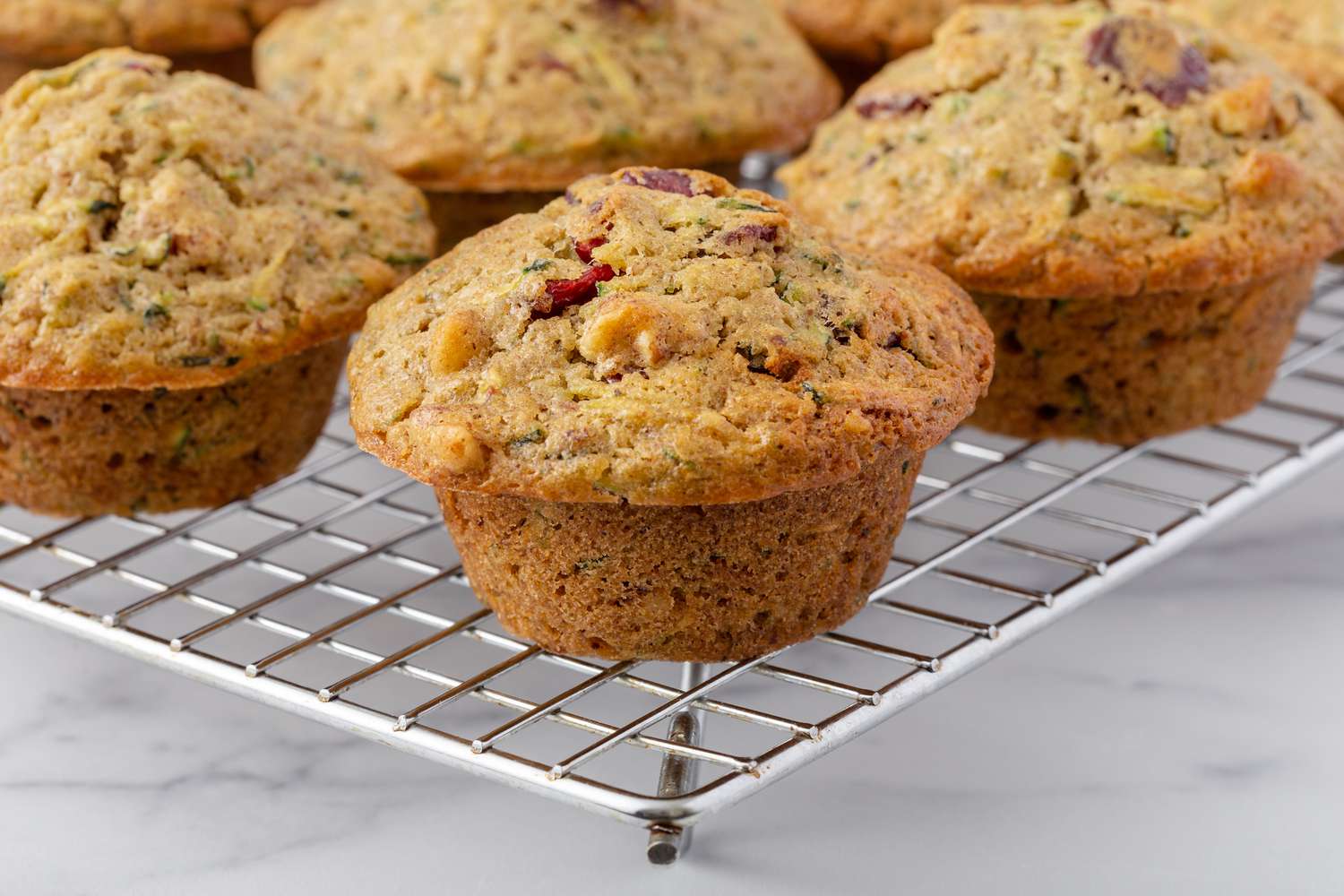 Zucchini muffins made from garden zucchini on a cooling rack