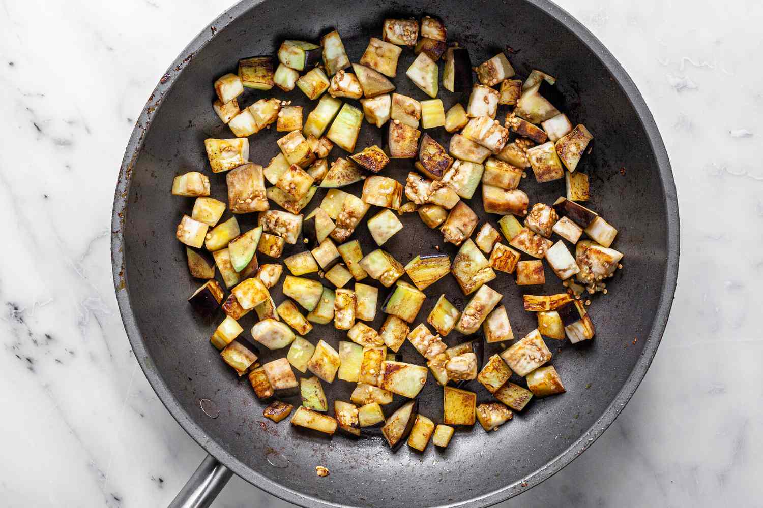 Cubed Eggplant Cooked in Skillet for Classic Ratatouille