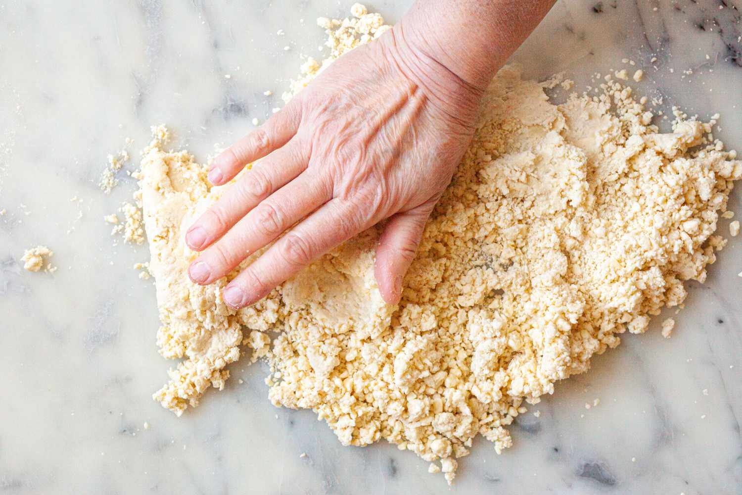 Making turkey pot pie dough.