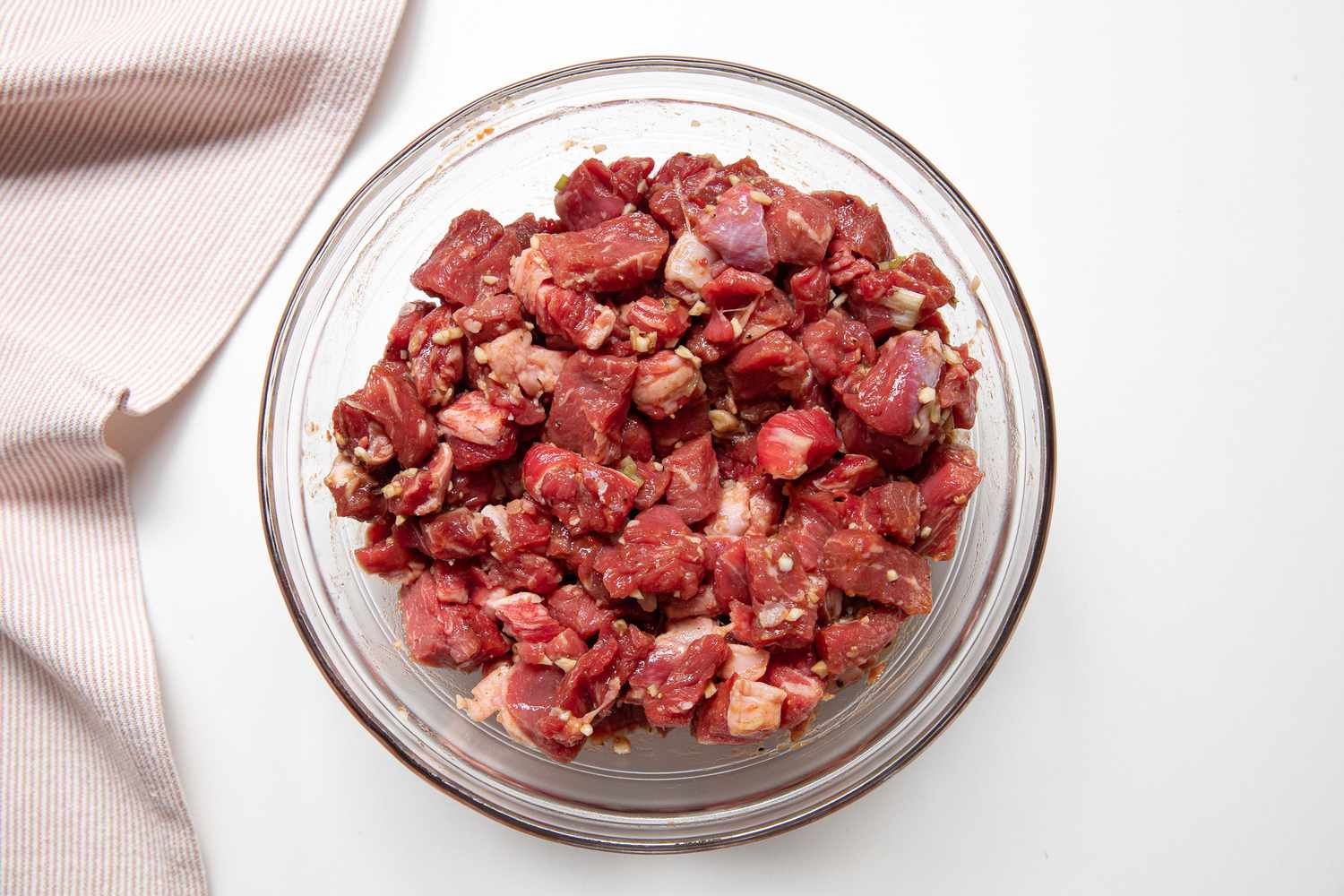 Cubed Beef Marinating in a Bowl for Cambodian Lok Lak Recipe