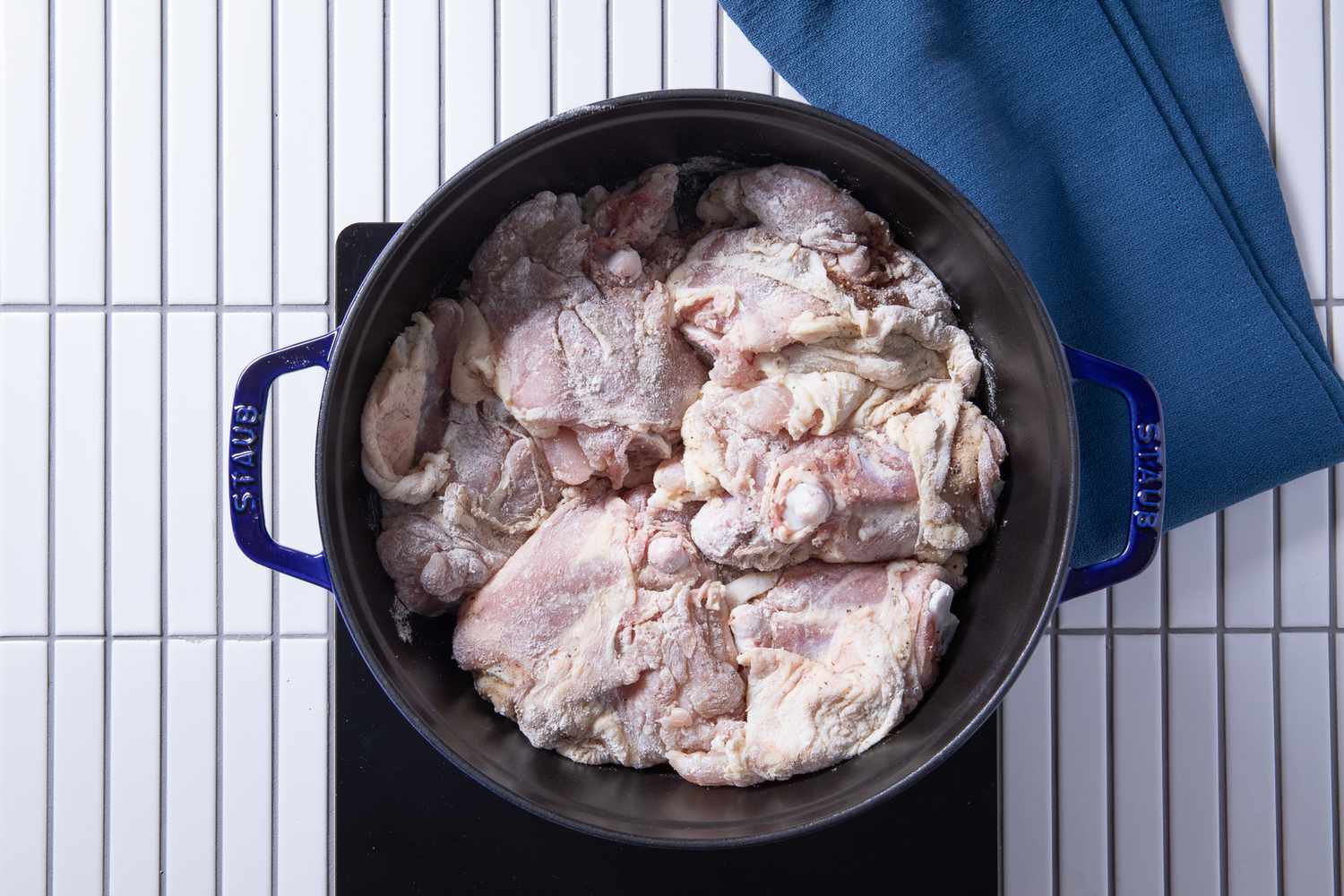 chicken thighs searing on the dutch oven for chicken fricassee recipe