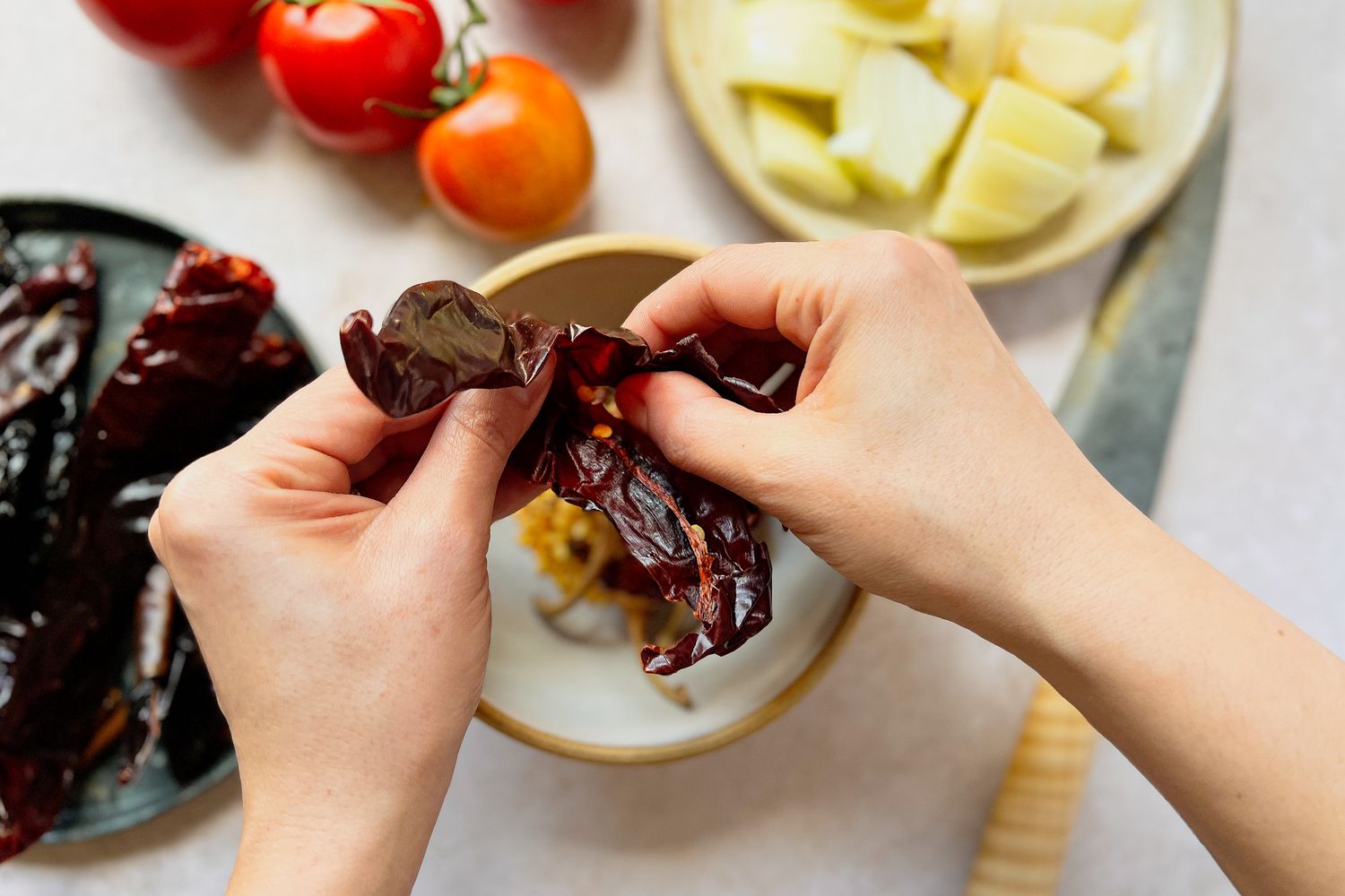 Seeds being removed from Peppers for Birria