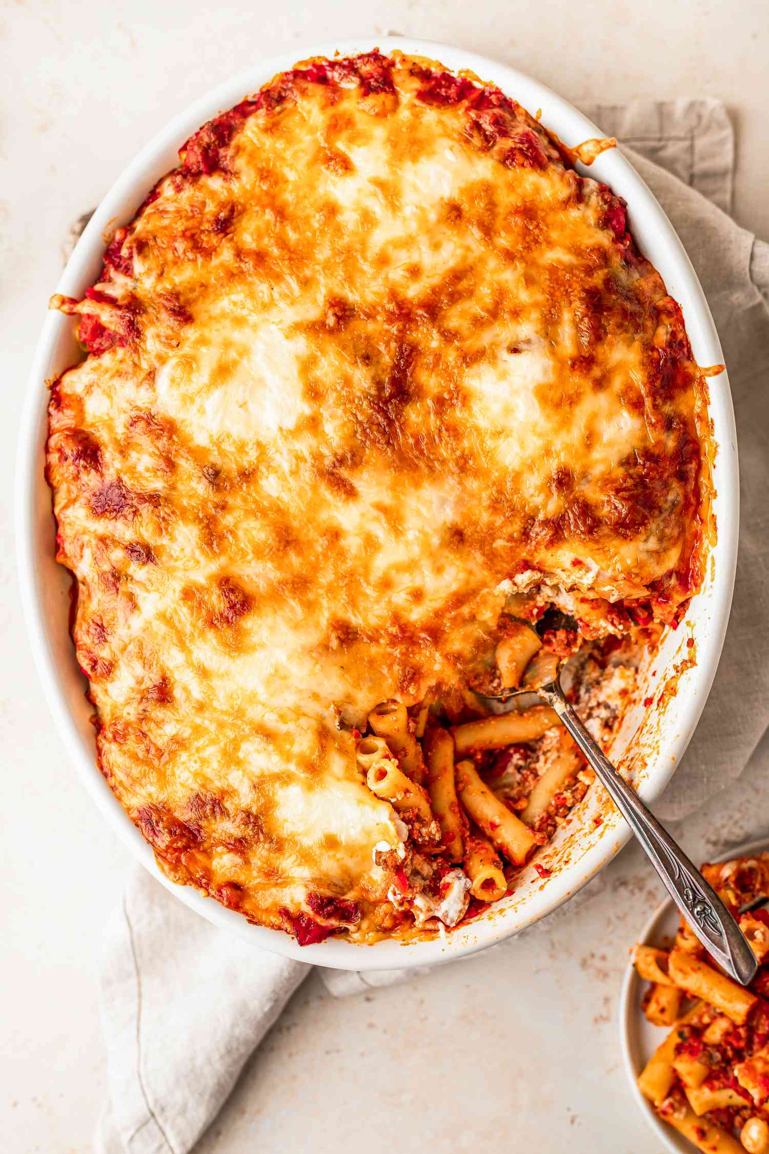 Casserole dish of cheesy baked ziti