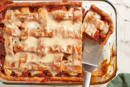 Sweet potato sonker in a baking dish with a piece being served
