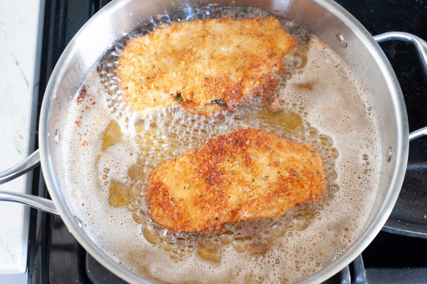 Fry Chicken Kiev in frying pan. 