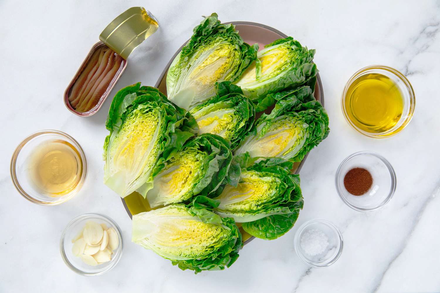 Prepared ingredients including lettuce, oil, and garlic for a recipe