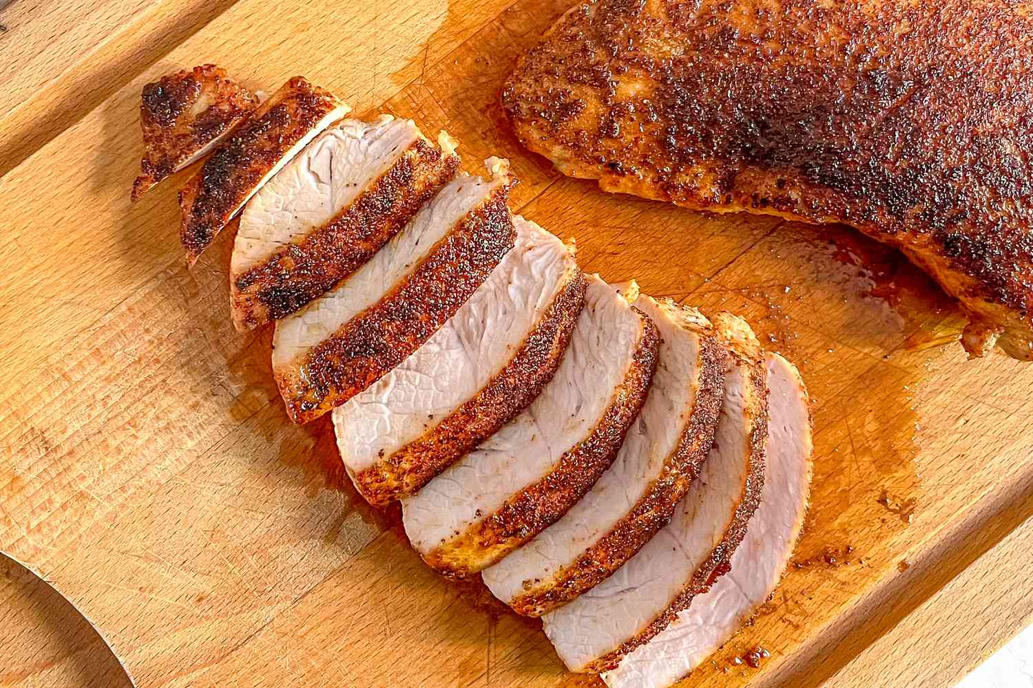 Turkey Tenderloin Sliced on a Cutting Board