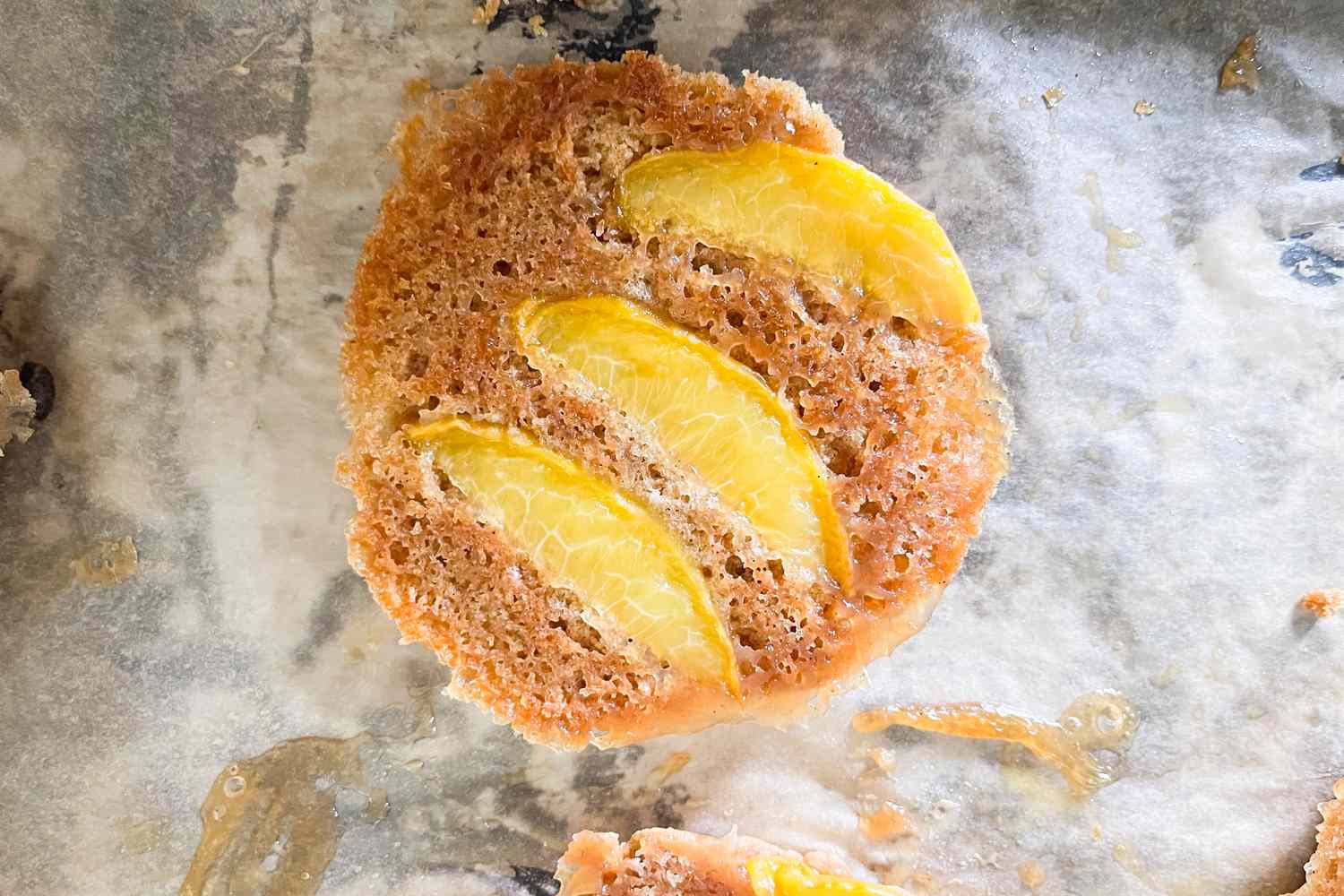 Peach upsidedown cookie on a baking sheet