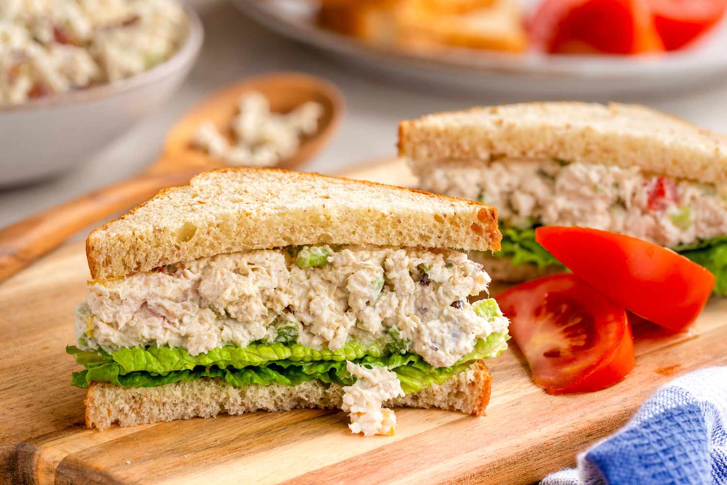 Chicken salad sandwich on a cutting board