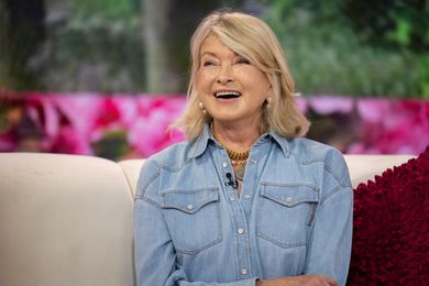 Martha Stewart smiles while sitting on a couch on Wednesday, June 7, 2023