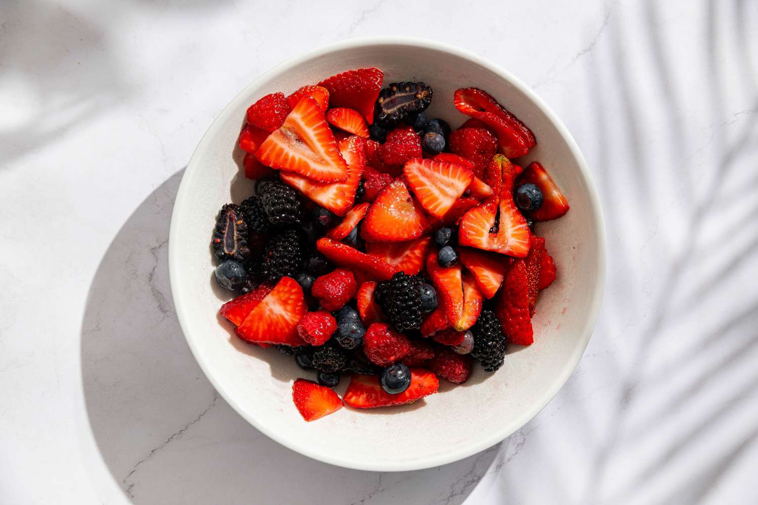 bowl of fresh berries for Easy Berry Chantilly Cake