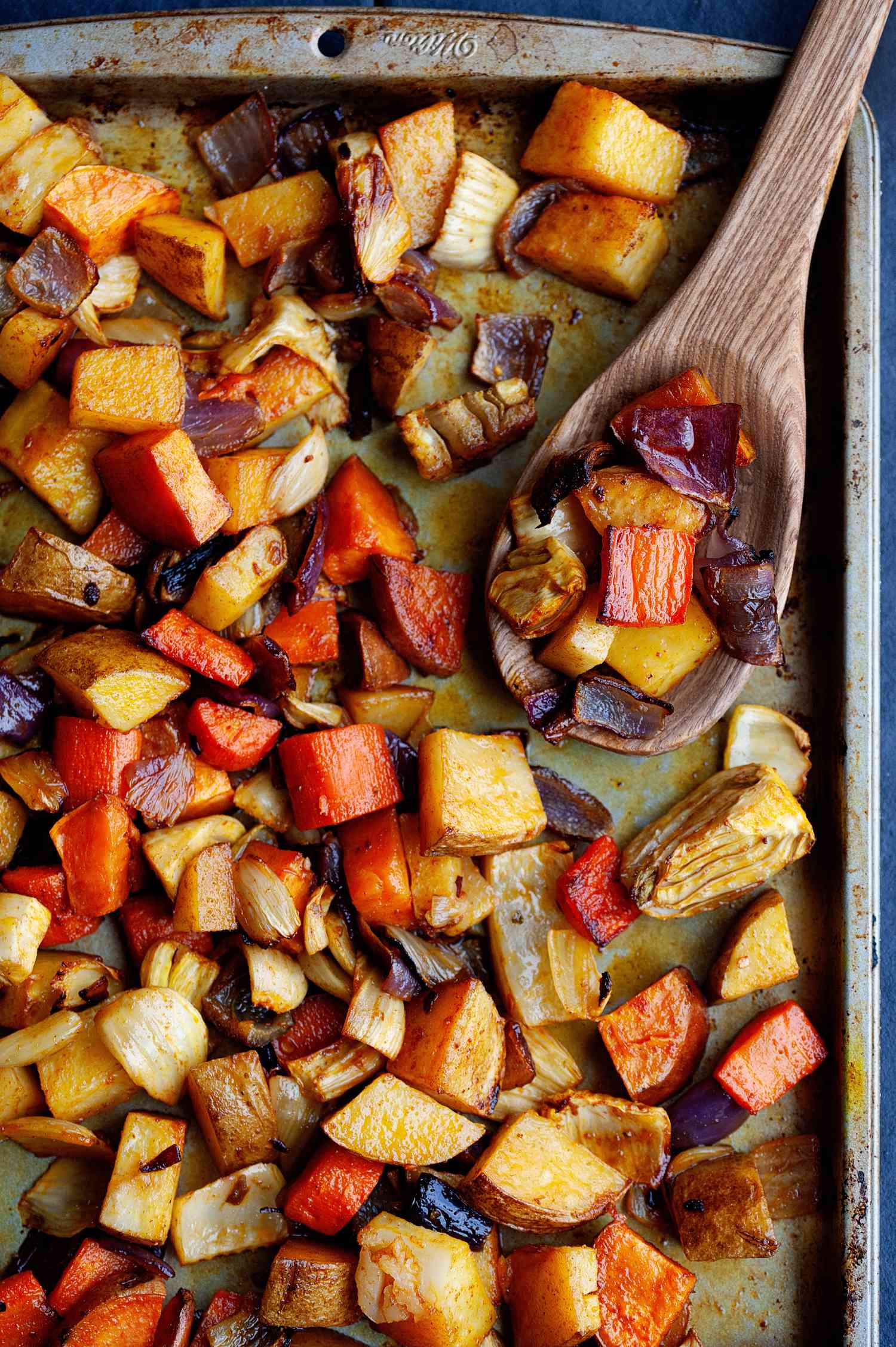 Overhead view of anytime roasted vegetables on a sheet pan.