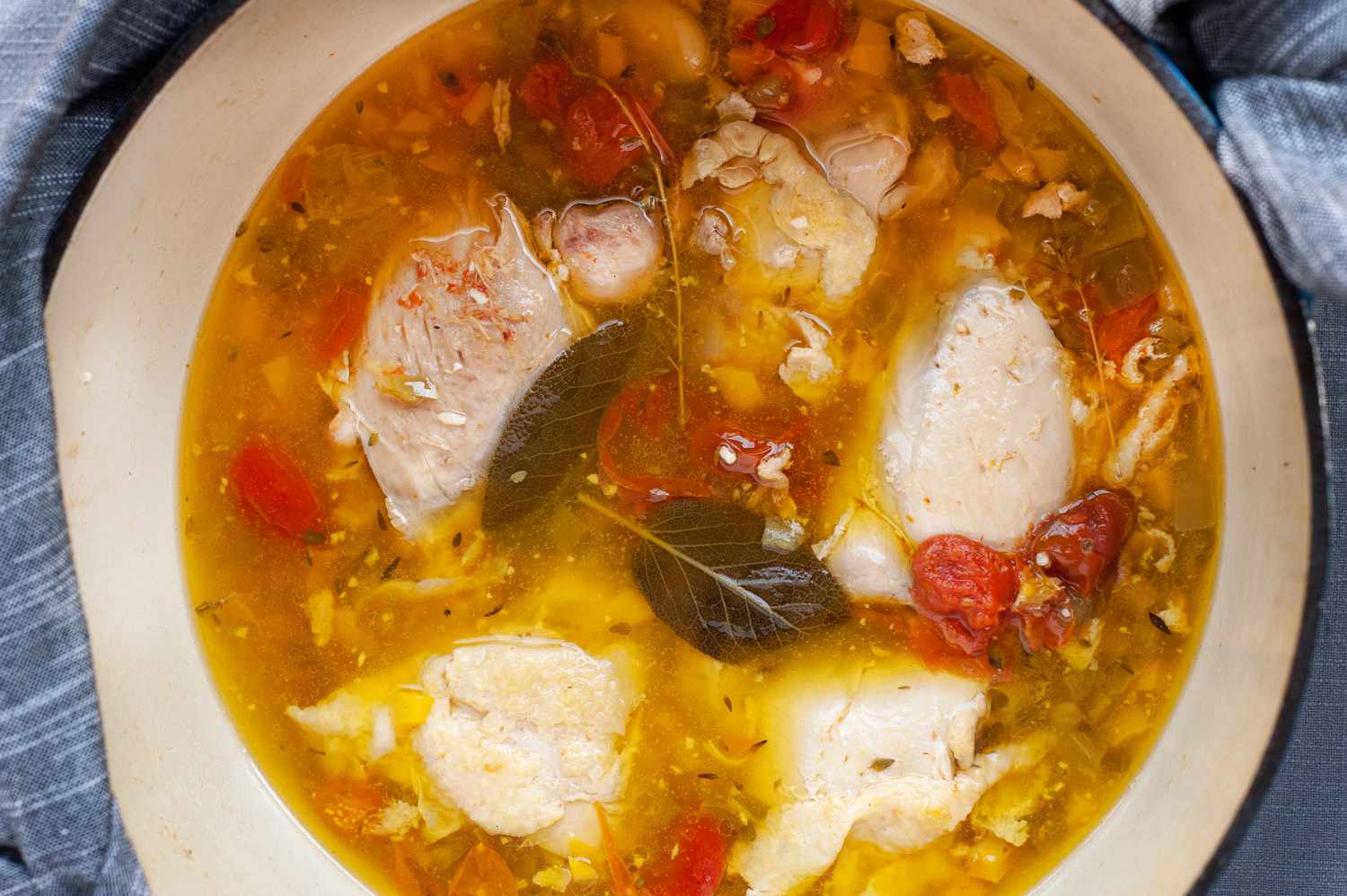 A pot of Stewed Chicken with Golden Tomatoes from New Native Kitchen