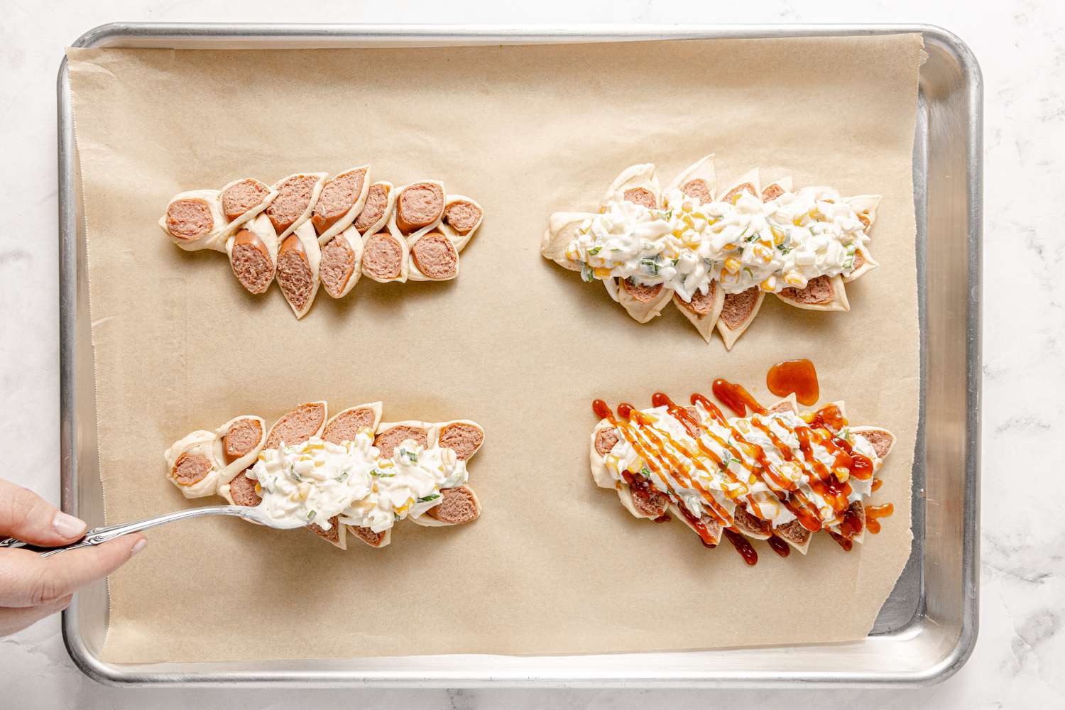 Corn Cheese and Ketchup Toppings Added to Pull-Apart Corn Cheese Pigs in a Blanket 