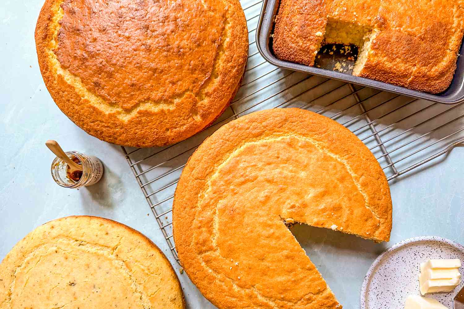 Several cornbreads cooling on racks