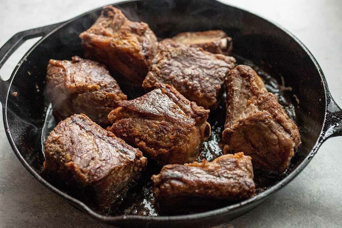 brown the short ribs in a skillet