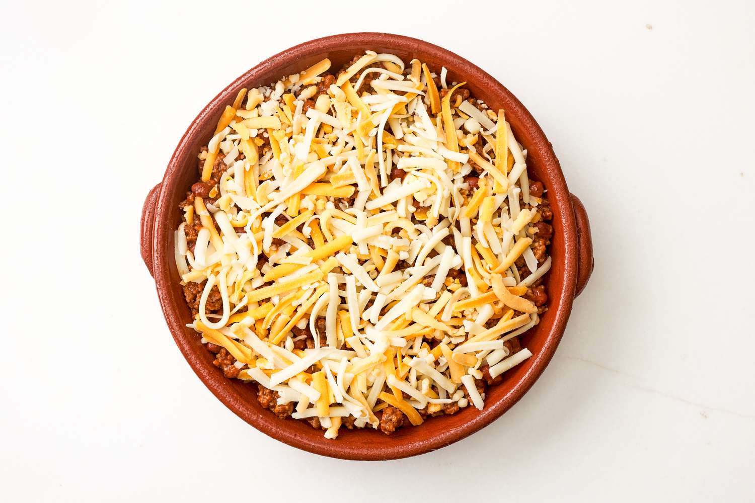 Chili layer topped with cheese for chili dip recipe