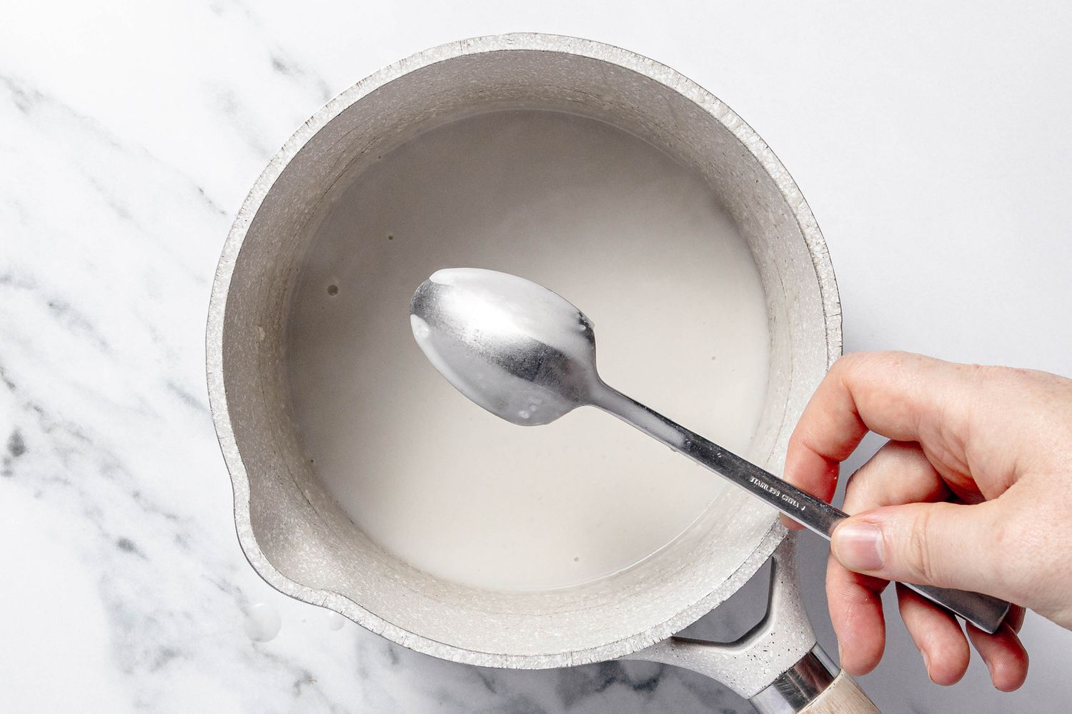 Some Sauce on the Back of a Spoon With a Streak on It to Showcase Desired Consistency