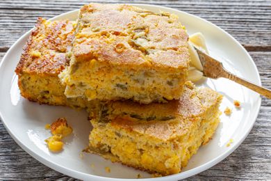 Pieces of Green Chile Corn Bread Recipe on Plate with Butter