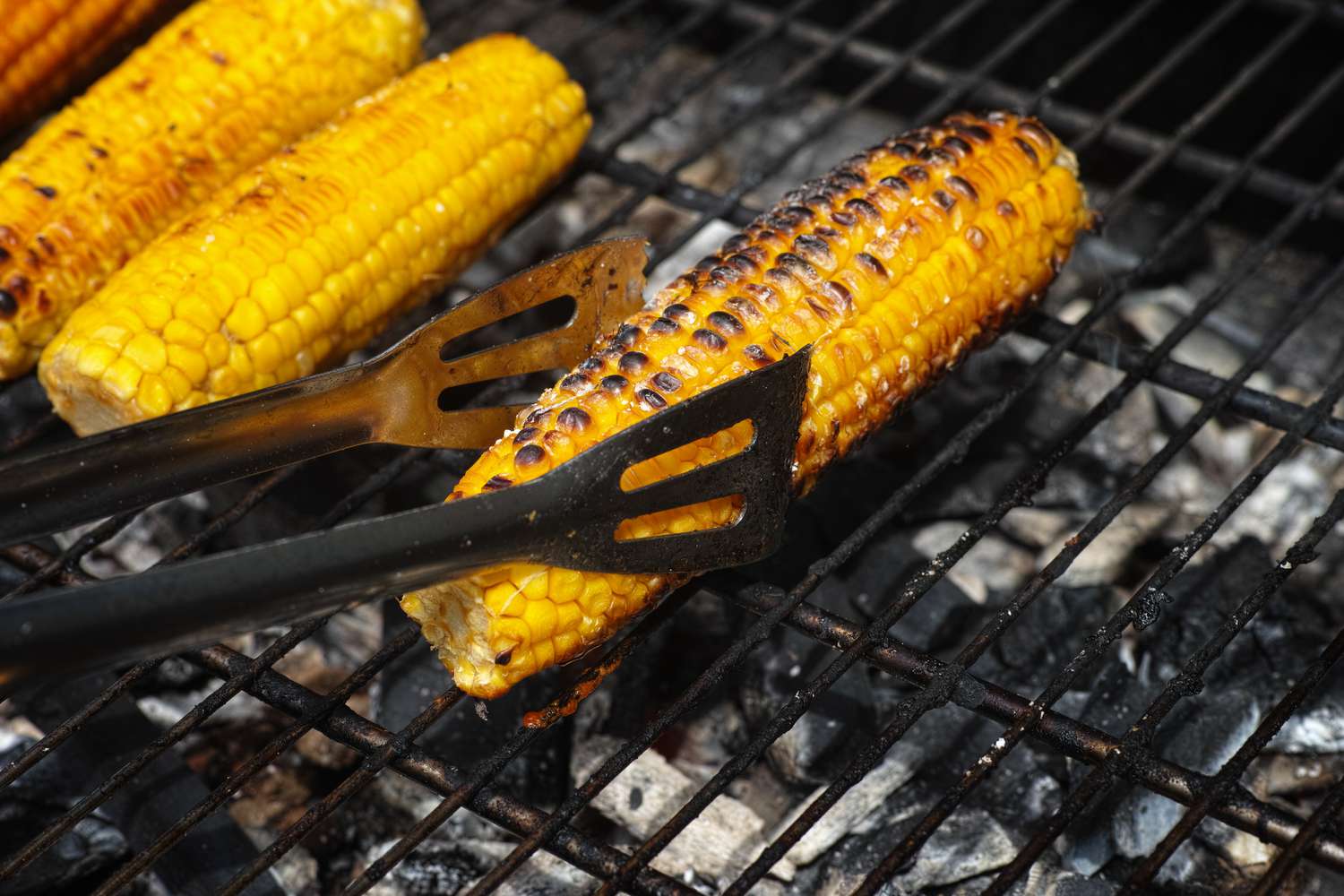 corn roasting on a grill