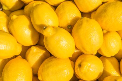 A pile of bright yellow lemons