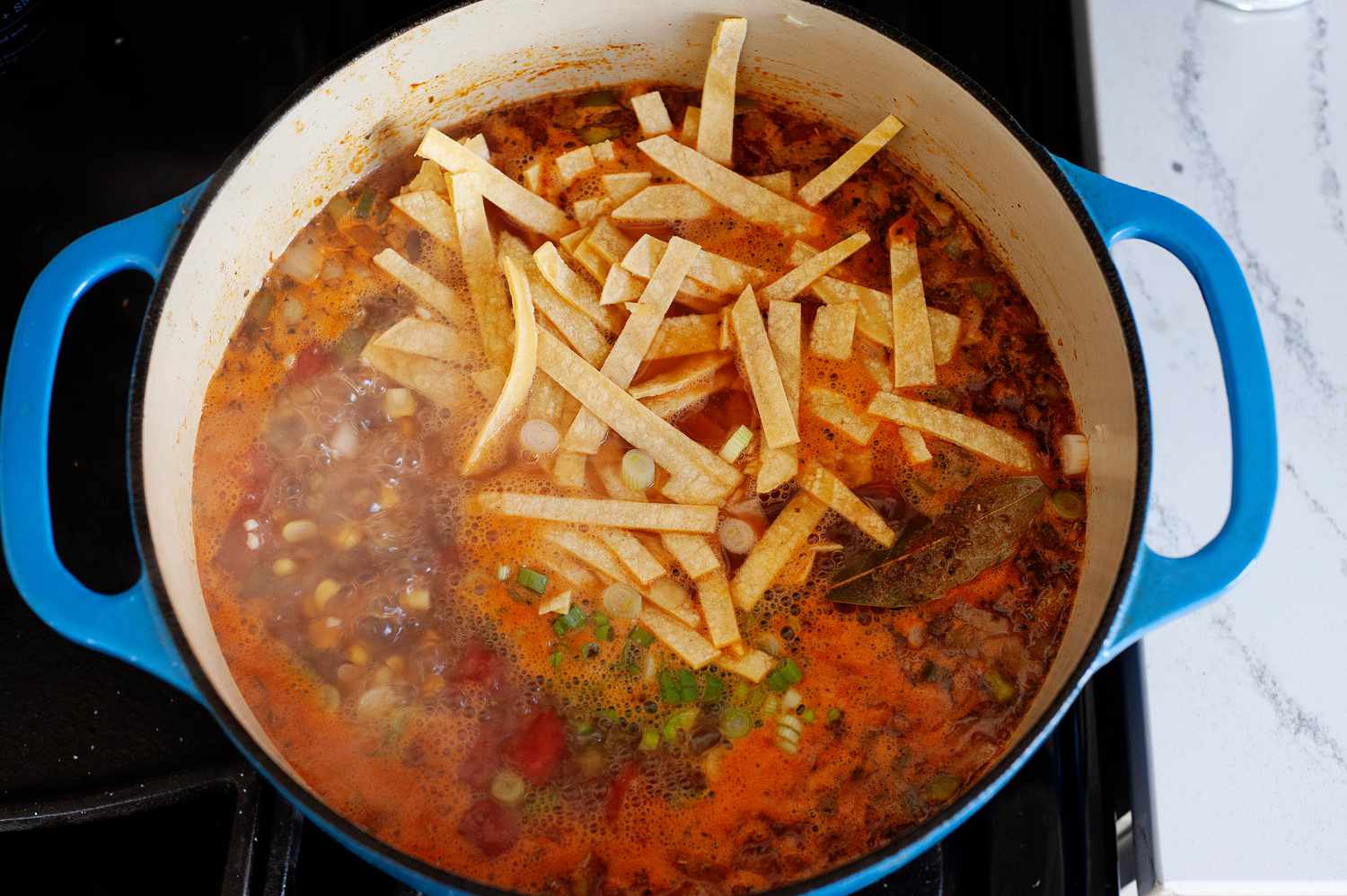 Vegetarian-friendly tortilla soup in a dutch oven.