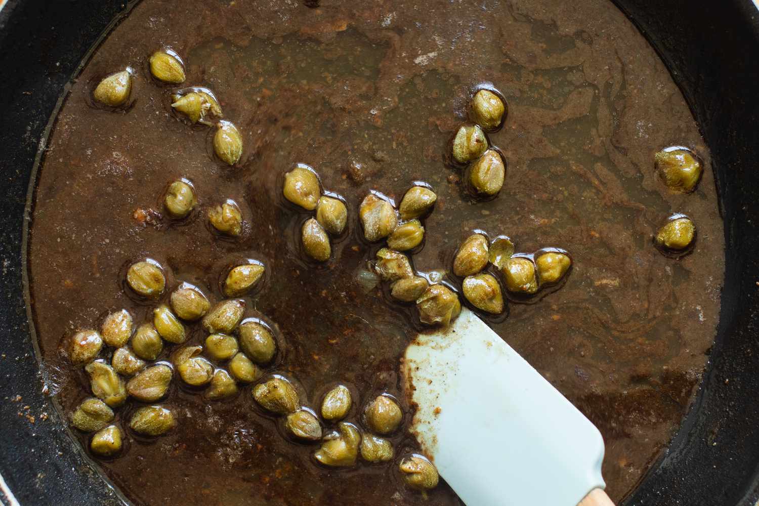 Capers Cooked in Stock for Chicken Piccata