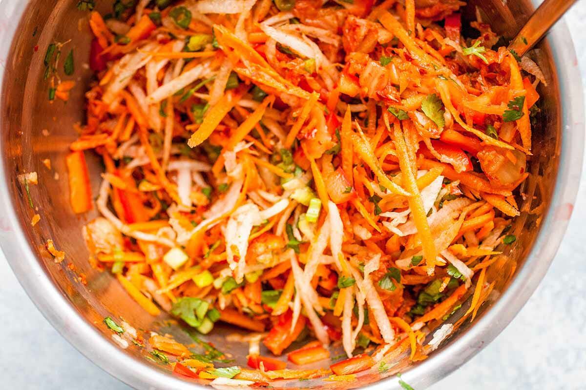 Grilled Hot Dog Recipe with Kimchi Slaw combine the slaw ingredients