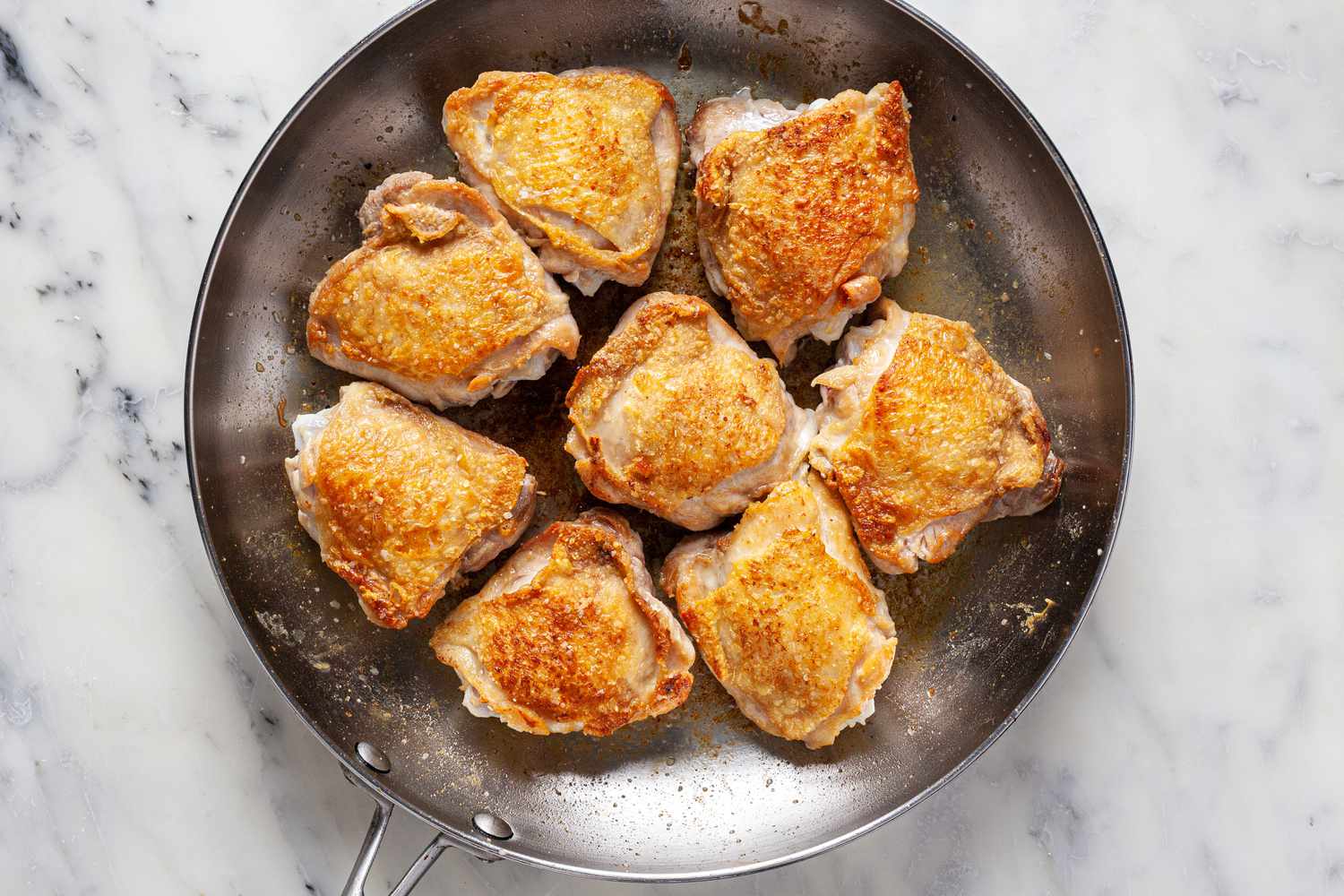 Brown chicken thighs until golden brown.