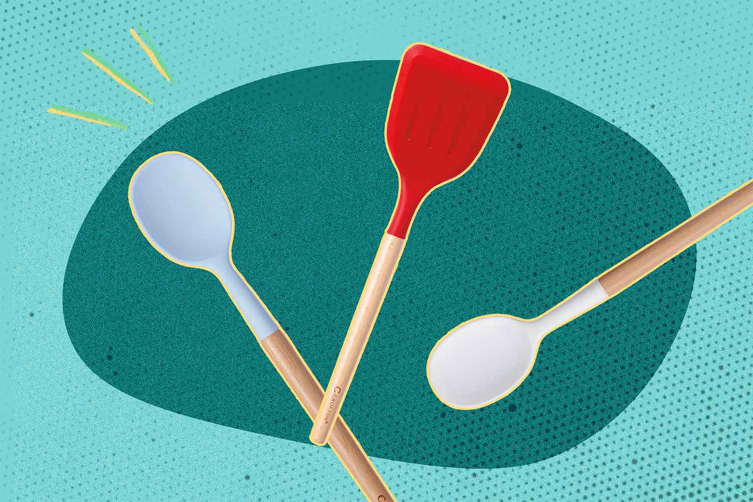 Three silicone kitchen utensils including two spoons and a spatula, arranged against a decorative background