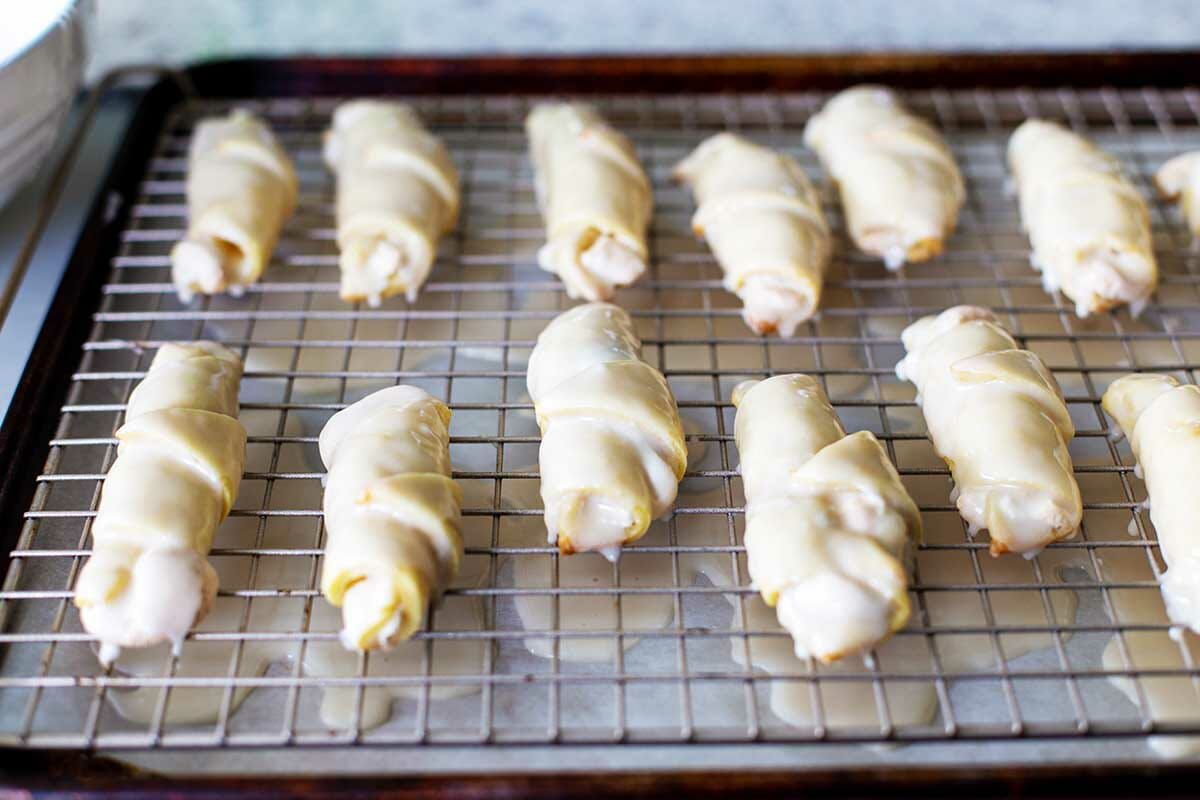 Flaky Butter Cookies coated in glaze and set on a cooling rack.