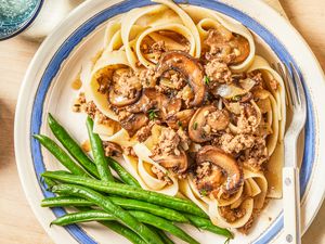 salisbury ground beef with a side of green beans on a plate