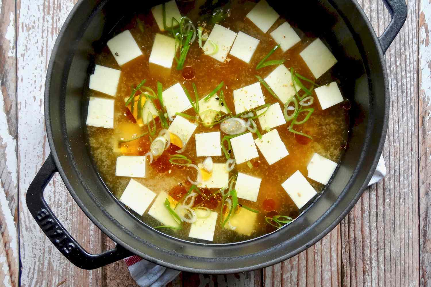 Miso soup with sesame oil and togarashi in a large pot.