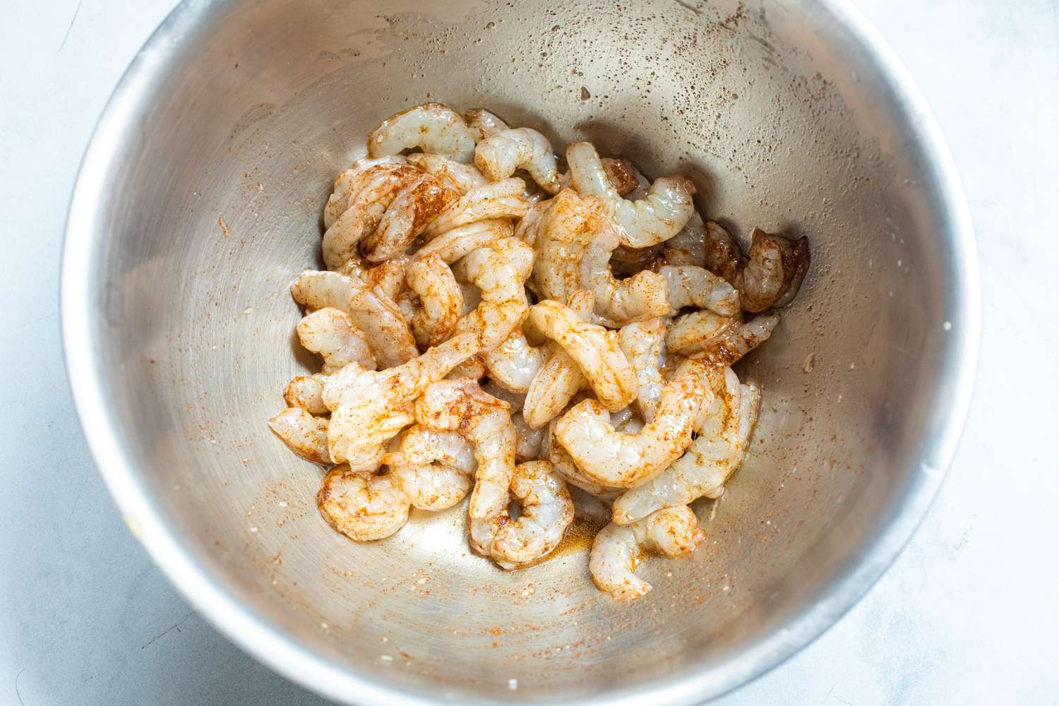 Raw shrimp in a bowl to make one pan garlic shrimp and asparagus.