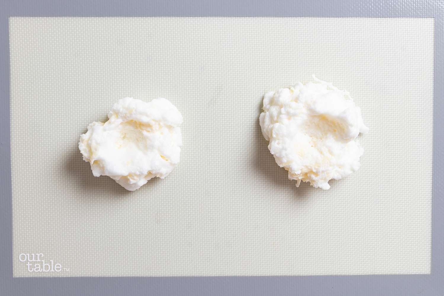 Mounds of beaten egg white on a pan to make Cloud Eggs