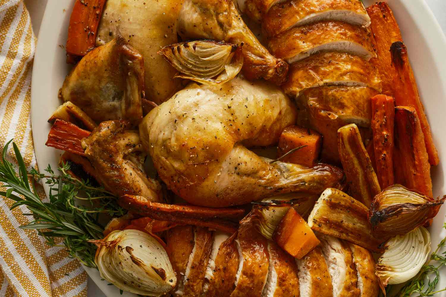 Carved chicken with vegetables on a platter