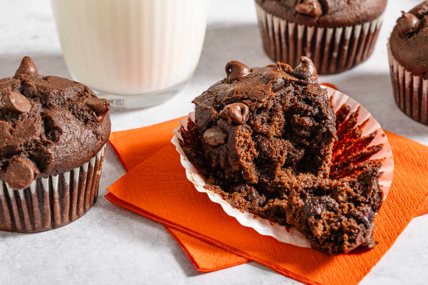 Pumpkin chocolate muffins with a glass of milk