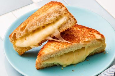 gooey grilled cheese sandwich on a plate