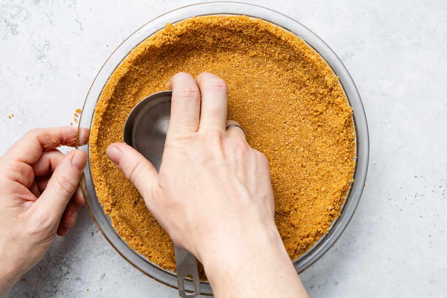 Bottom of Measuring Cup Used to Press Graham Cracker Crumb Securing Into the Pie Pan