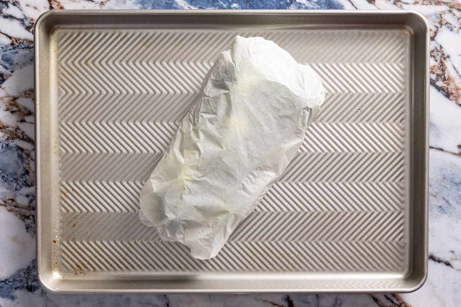 broccoli and ice wrapped in a parchment pocket for crispy parmesan broccoli recipe