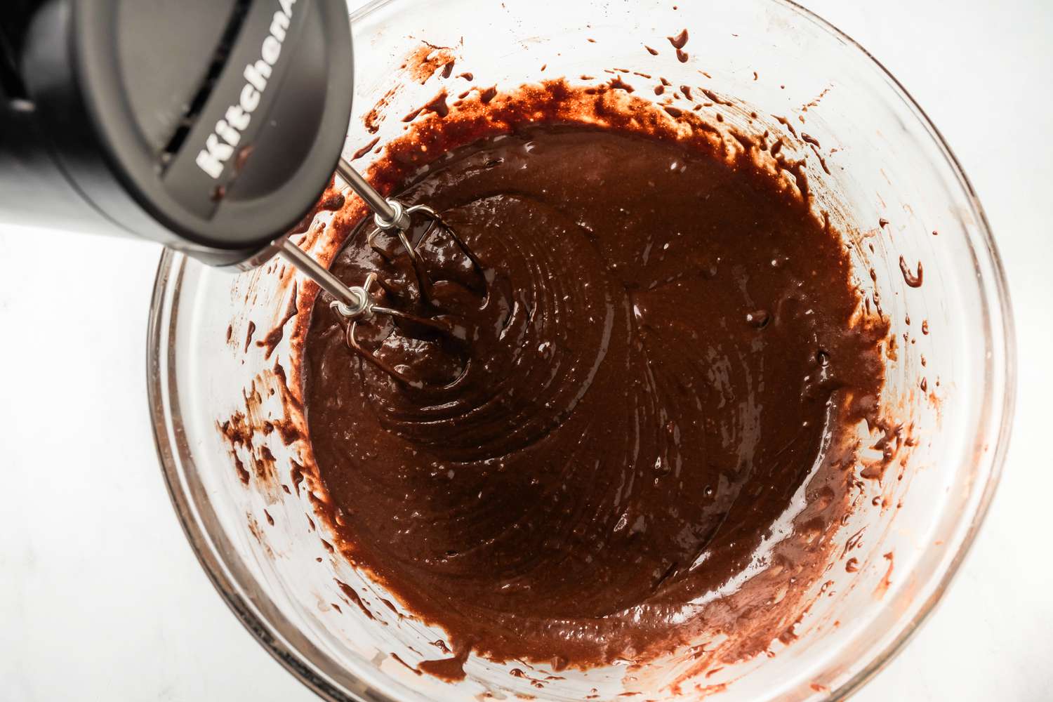 chocolate cake batter whisked together with a handmixer for earthquake cake recipe