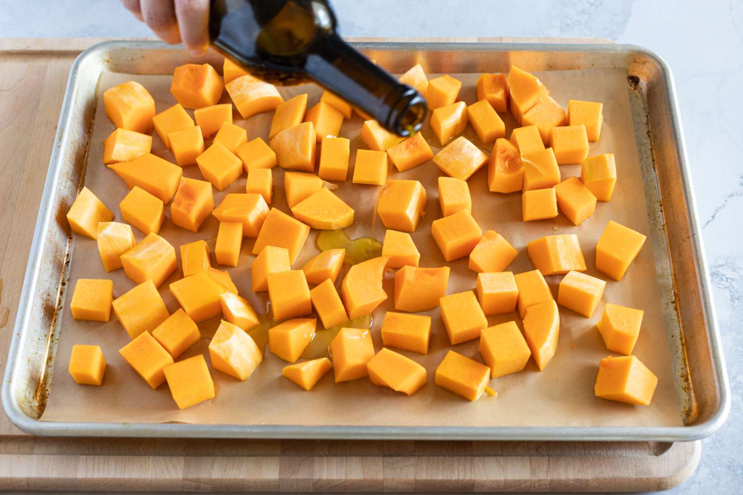 Butternut squash cubes on a sheet pan