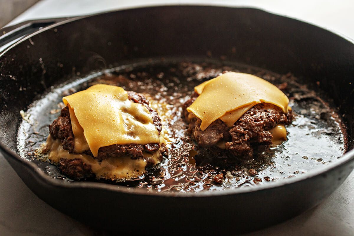 Stovetop Burger Recipe stack the burgers and add cheese