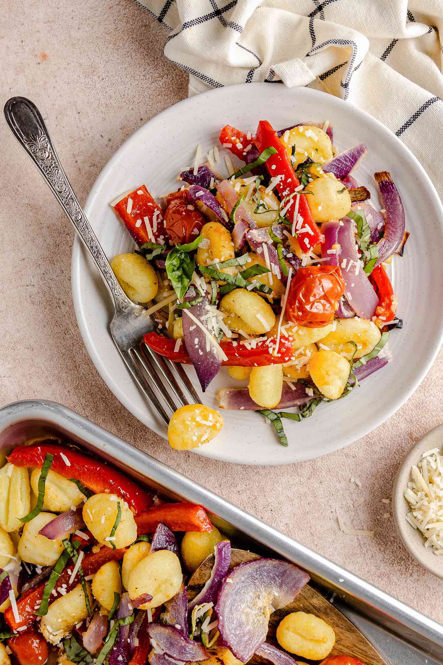 Sheet Pan Gnocchi with Zucchini, Tomatoes, and Bell Peppers on a Plate and More in a Sheet Pan