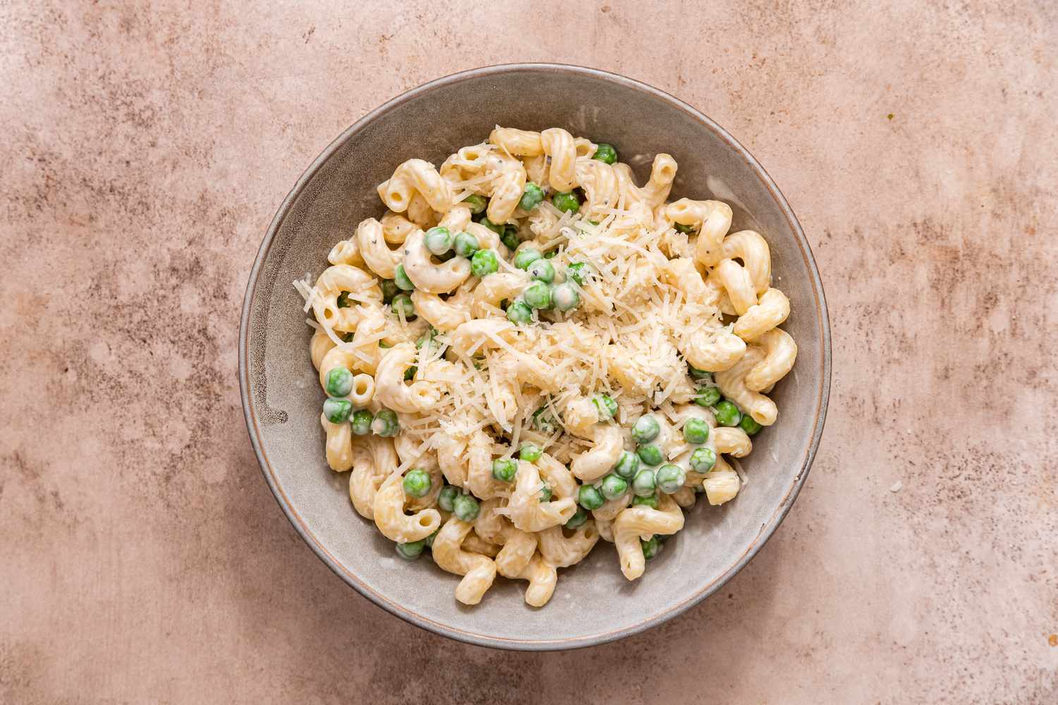 Bowl of Creamy Cavatappi Pasta Topped With Shredded Parmesan